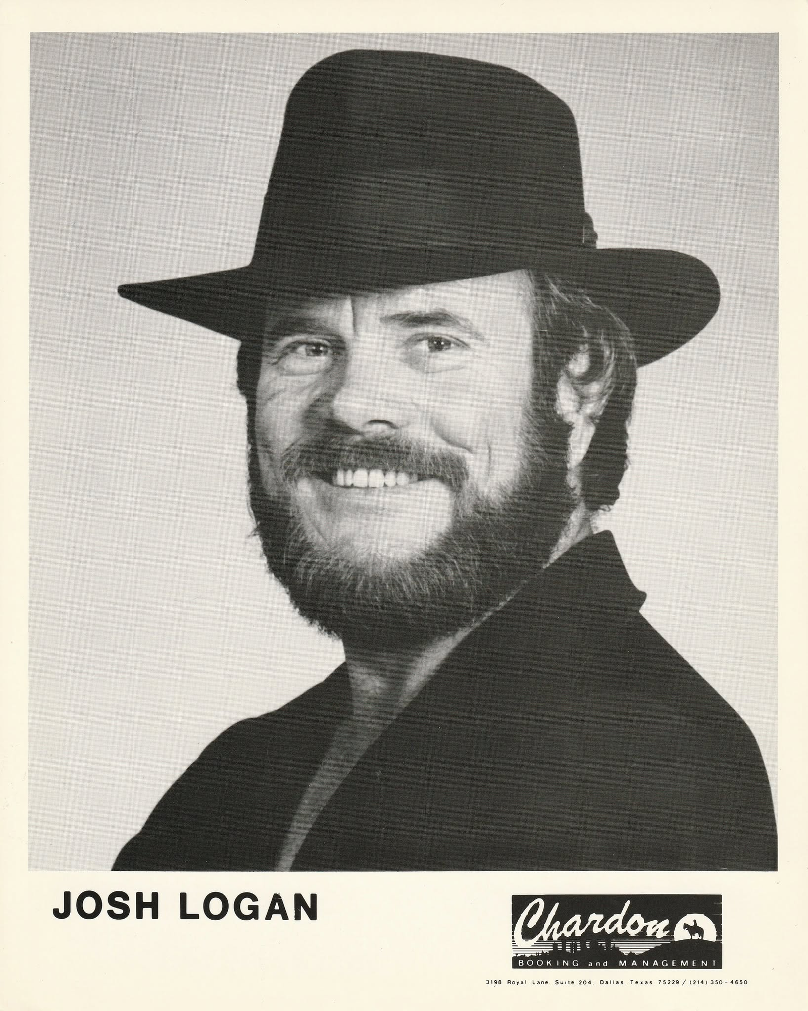 Black-and-white promotional portrait of Josh Logan